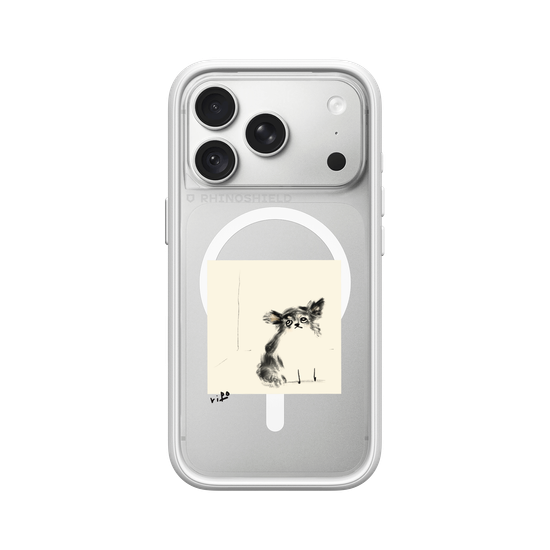 A Chihuahua sitting and staring.